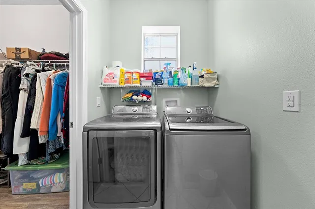a view of a workspace with wooden floor