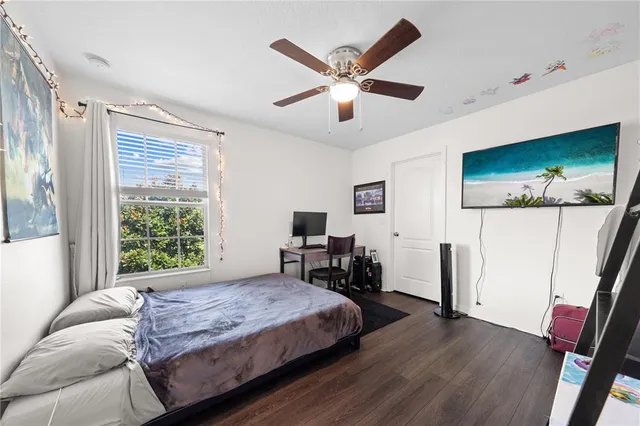 a bedroom with a bed and a dresser in it