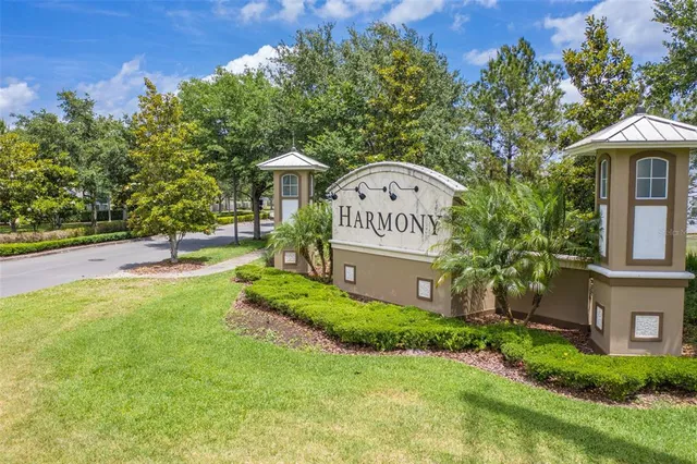 a view of a lake with a car parked on the road