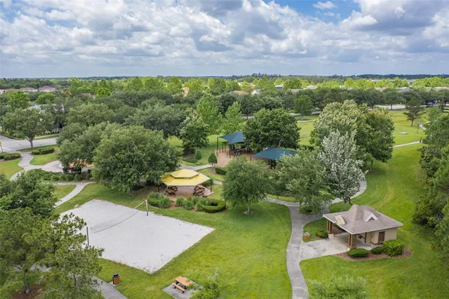 an aerial view of residential house with outdoor space and parking