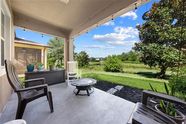 a view of a sitting area with furniture and garden