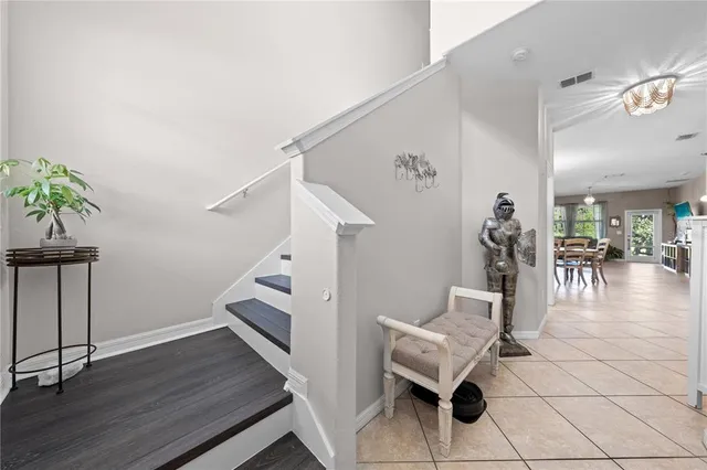 a large kitchen with a table and chairs