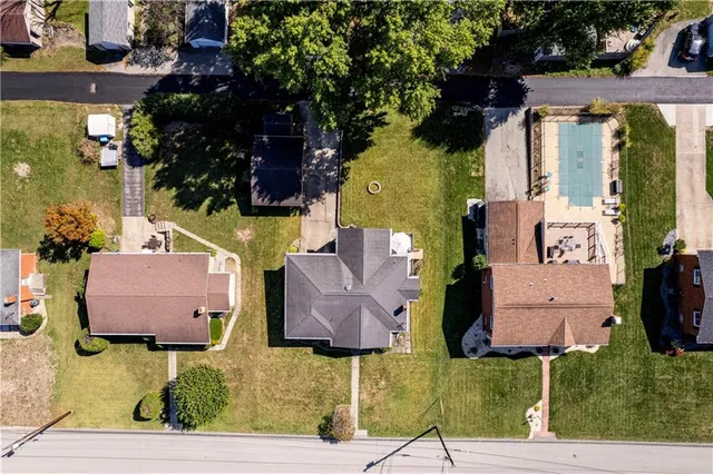 an aerial view of houses with outdoor space