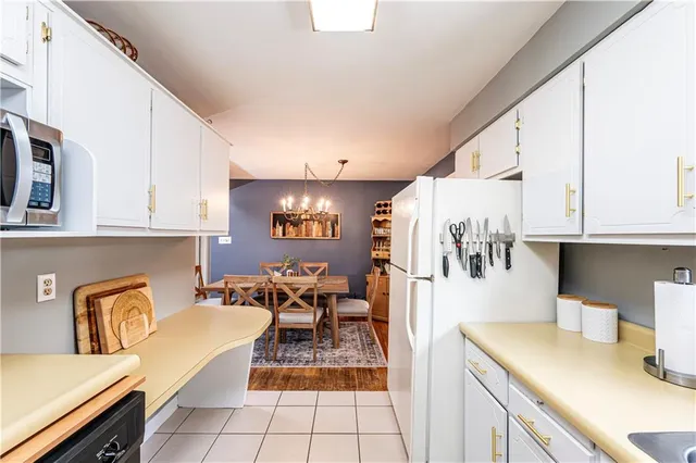 a living room with furniture and a dining table