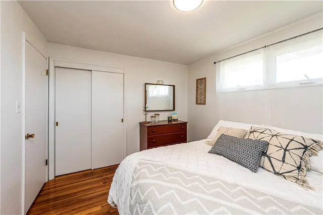 a bedroom with a bed and a tv