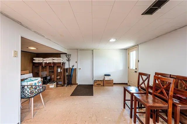 a view of a livingroom with furniture and white walls
