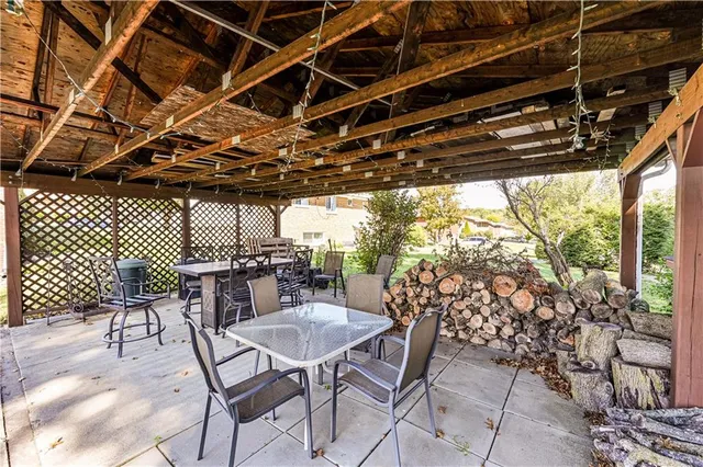 a view of a dinning table and chairs in patio