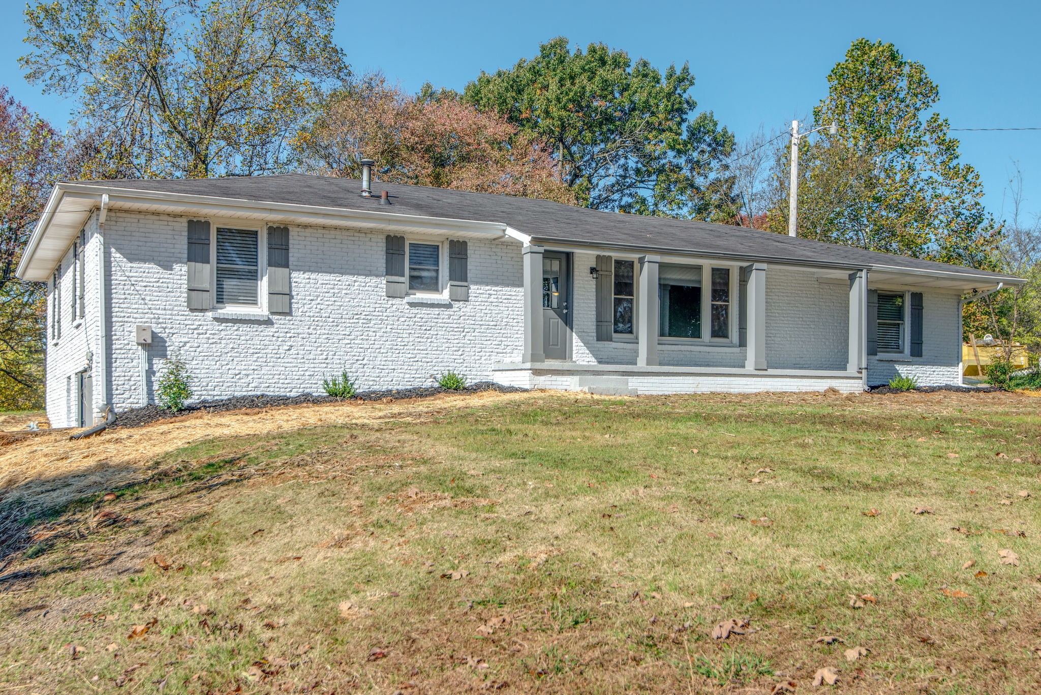 2154 Lake Road Greenbrier, TN 37073 - Photo 2 of 24 a house that has a tree in front of it