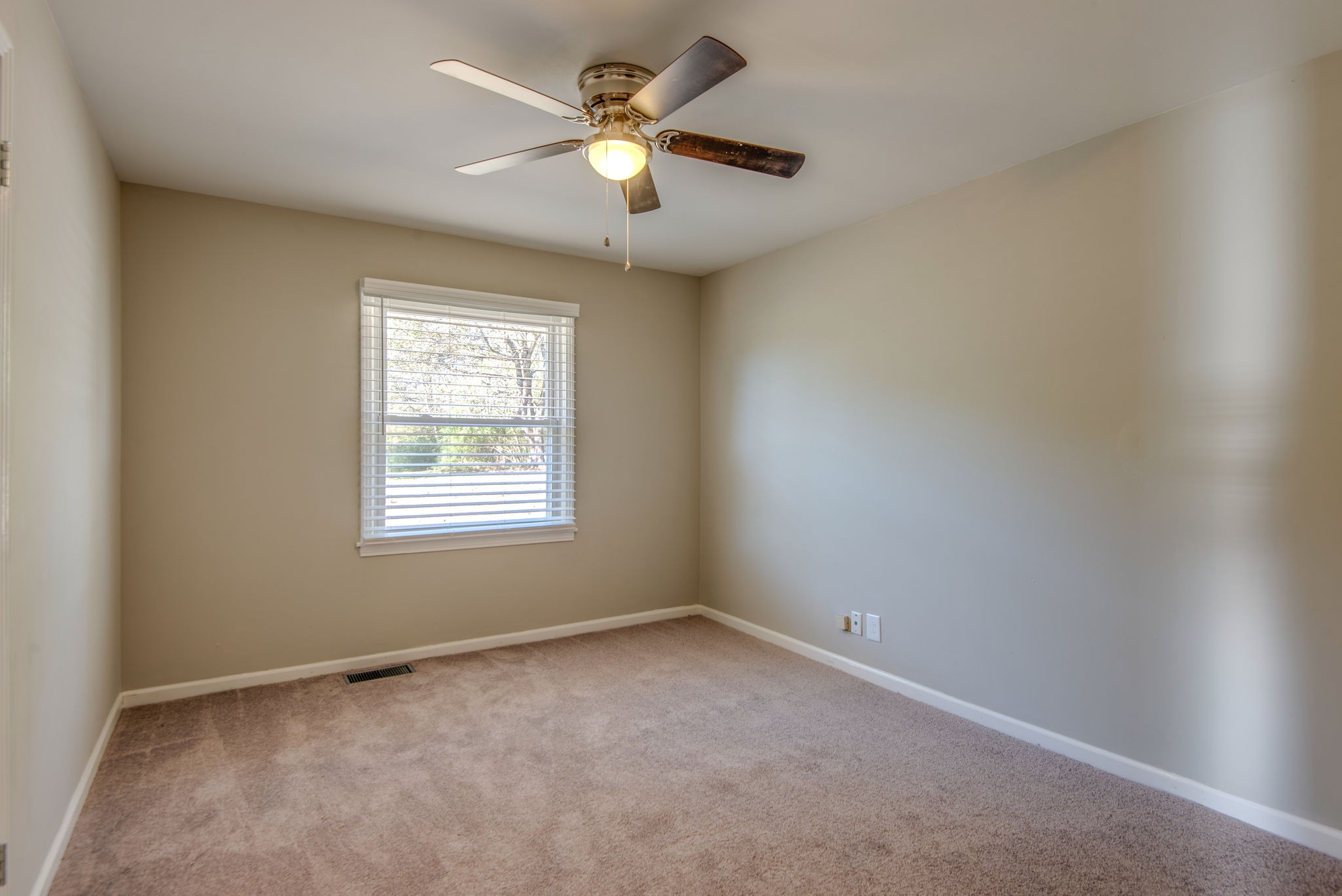 2154 Lake Road Greenbrier, TN 37073 - Photo 16 of 24 an empty room with a window and a fan
