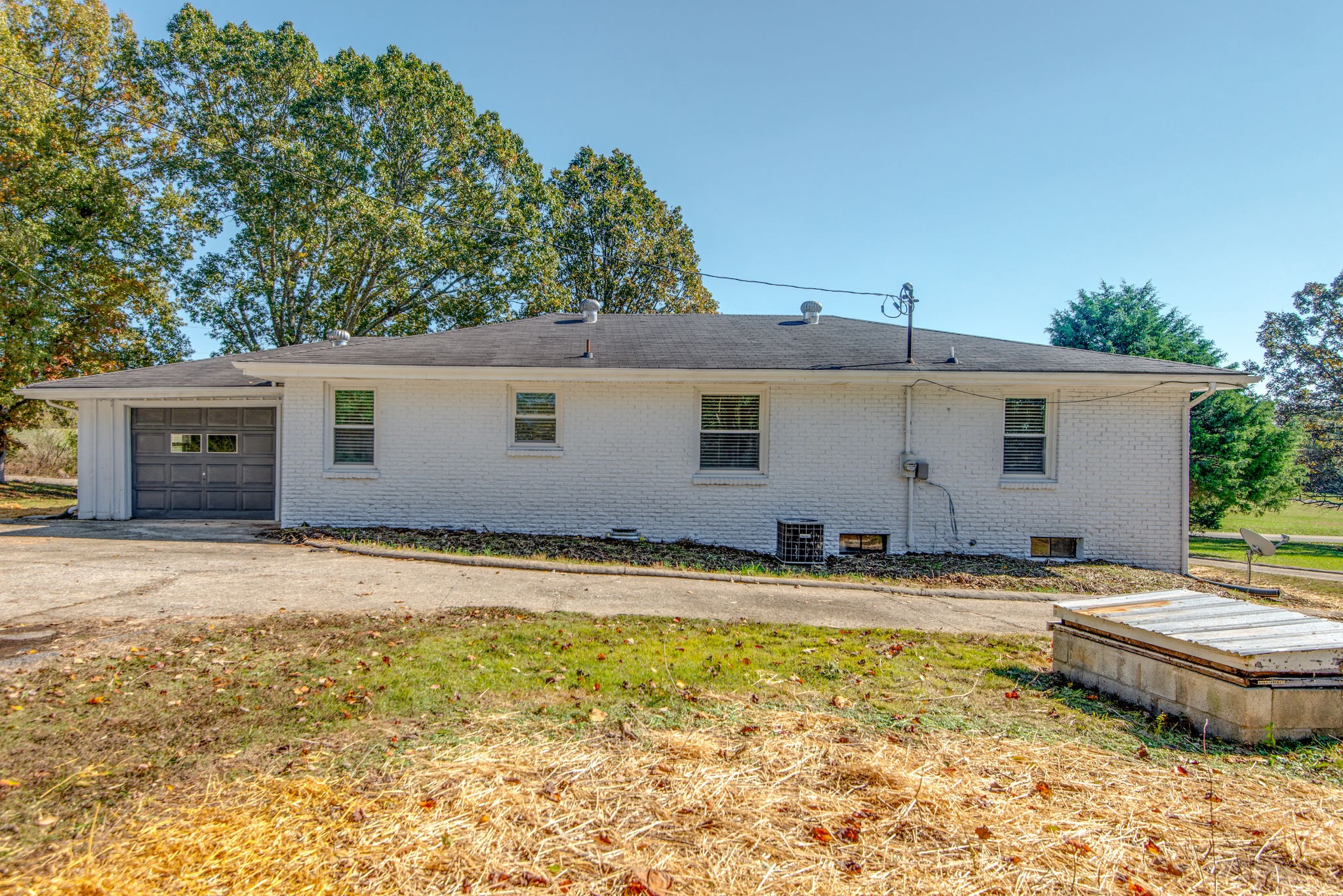 2154 Lake Road Greenbrier, TN 37073 - Photo 20 of 24 a backyard of a house with swimming pool and outdoor seating