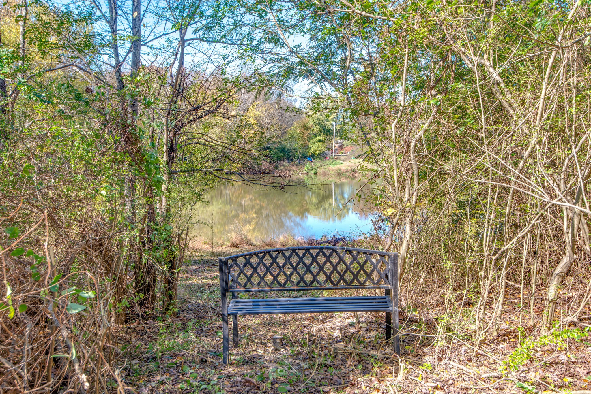 2154 Lake Road Greenbrier, TN 37073 - Photo 23 of 24 a wooden bench sitting in front of a house
