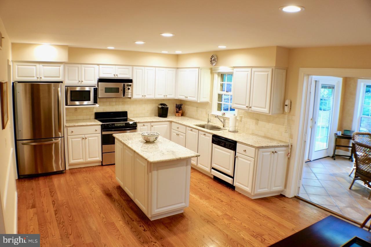 1066 Beaumont Road Berwyn, PA 19312 - Photo 15 of 40 Kitchen w/ site-finished hardwood floors & granite