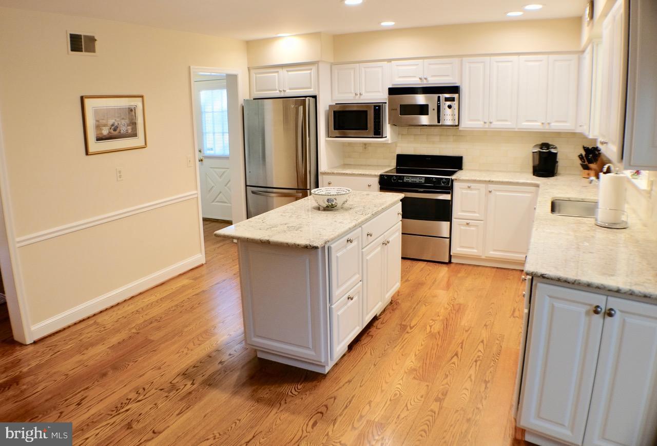 1066 Beaumont Road Berwyn, PA 19312 - Photo 17 of 40 Kitchen with site-finished hardwood and stainless