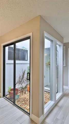 wooden floor with a glass door