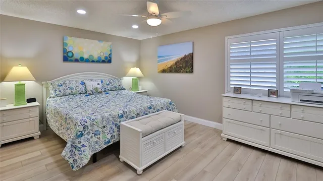 a living room with a bed furniture and a window
