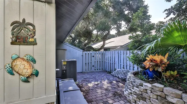 a view of a balcony with table and chairs