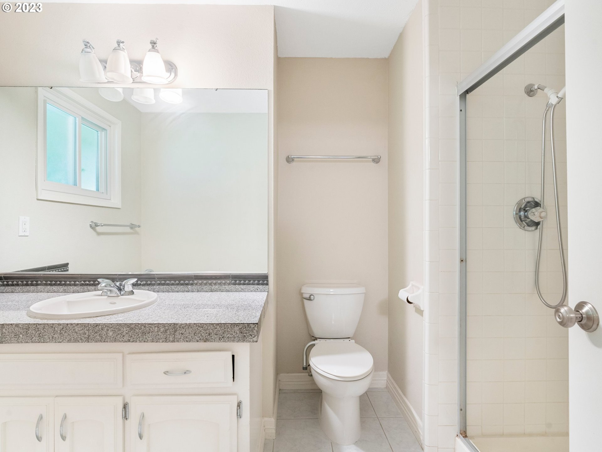 17875 Southwest Shawnee Trail Tualatin, OR 97062 - Photo 25 of 44 a bathroom with a granite countertop sink a toilet and a shower