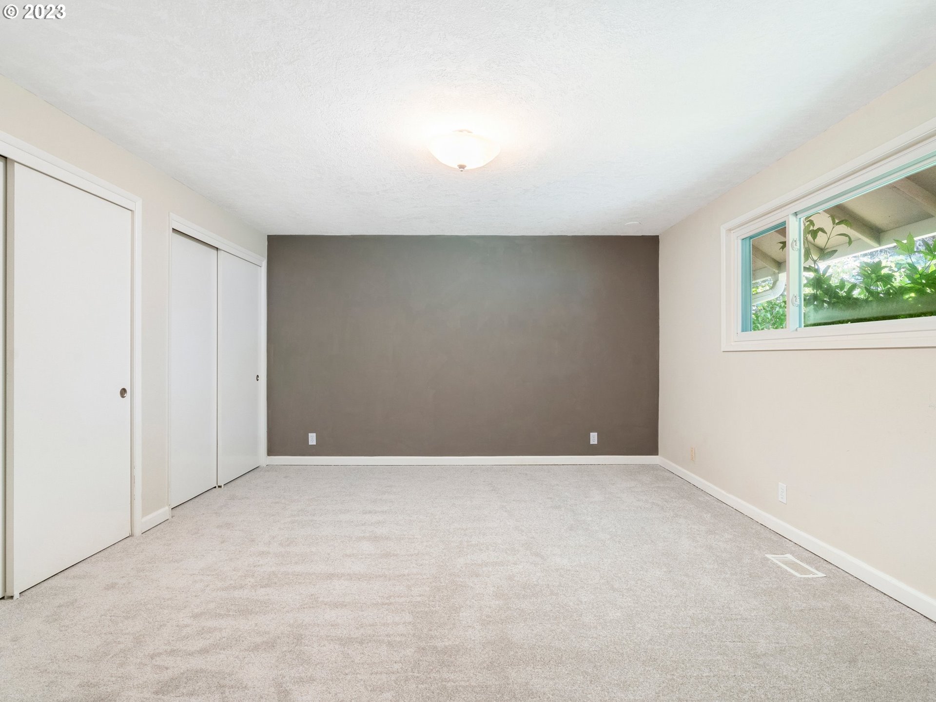 17875 Southwest Shawnee Trail Tualatin, OR 97062 - Photo 27 of 44 a view of an empty room with windows
