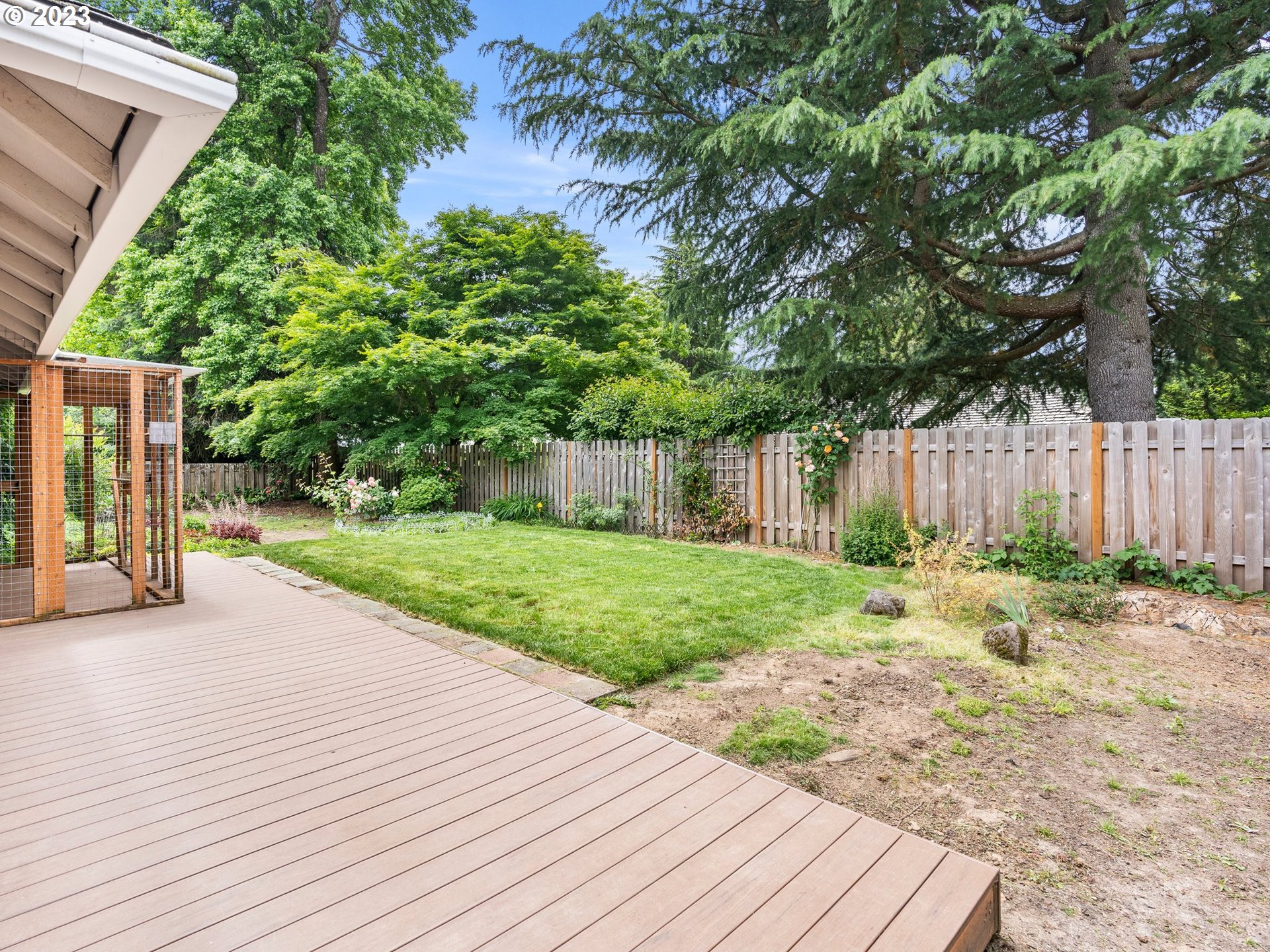 17875 Southwest Shawnee Trail Tualatin, OR 97062 - Photo 29 of 44 a view of a backyard with wooden fence