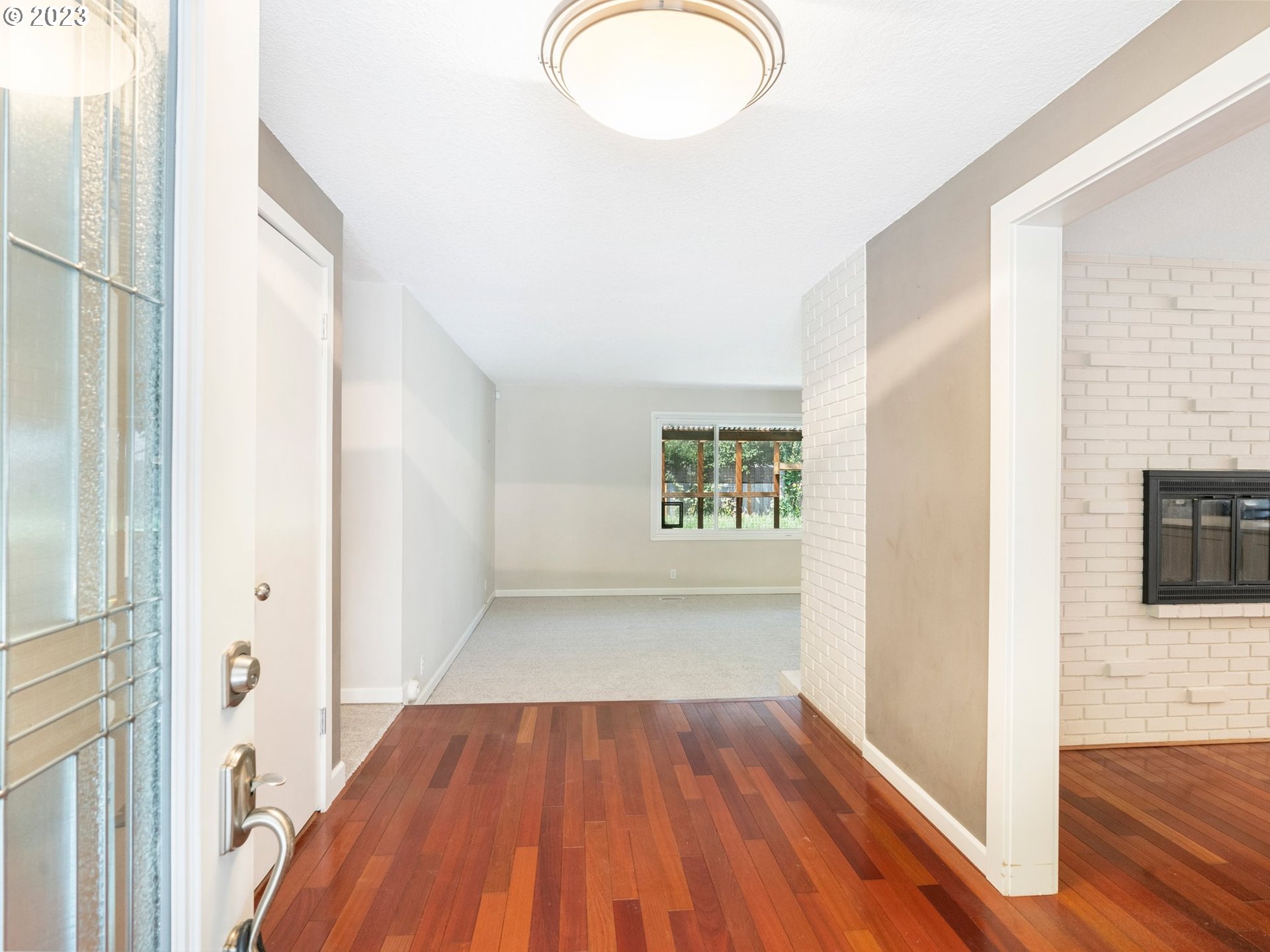 17875 Southwest Shawnee Trail Tualatin, OR 97062 - Photo 3 of 44 wooden floor in an empty room with a window