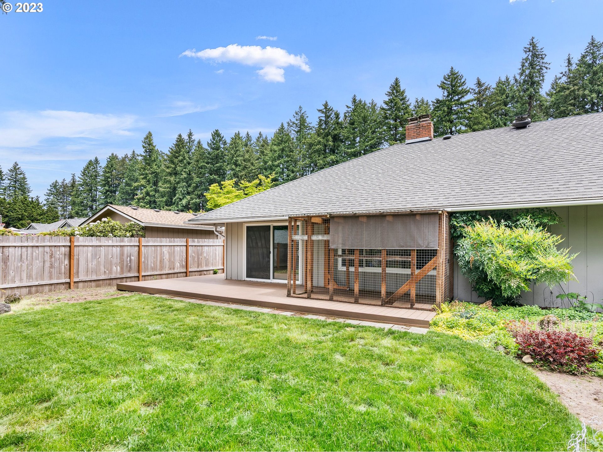 17875 Southwest Shawnee Trail Tualatin, OR 97062 - Photo 32 of 44 a view of a house with a yard and sitting area