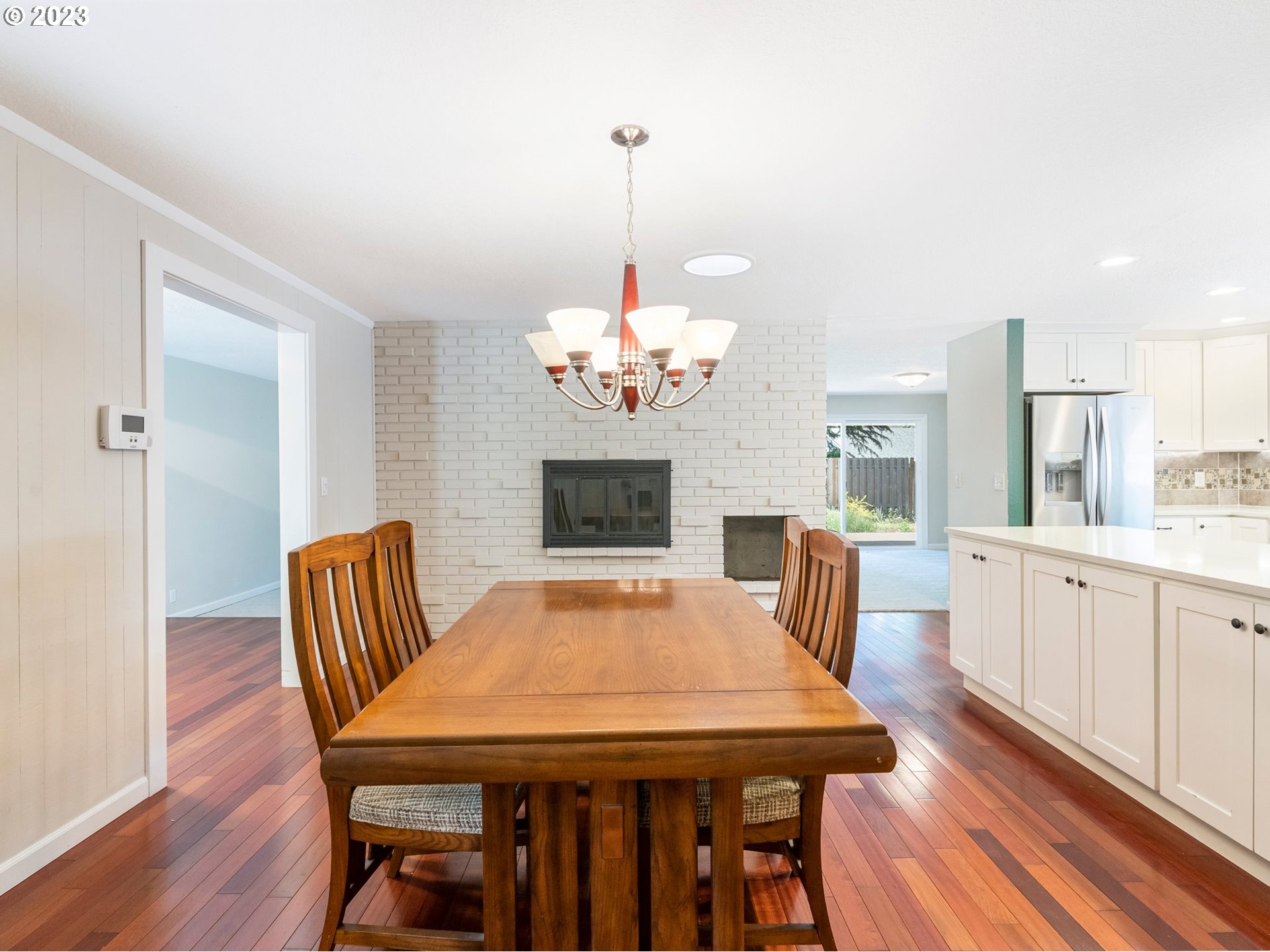 17875 Southwest Shawnee Trail Tualatin, OR 97062 - Photo 5 of 44 a view of a dining room with furniture a chandelier and wooden floor