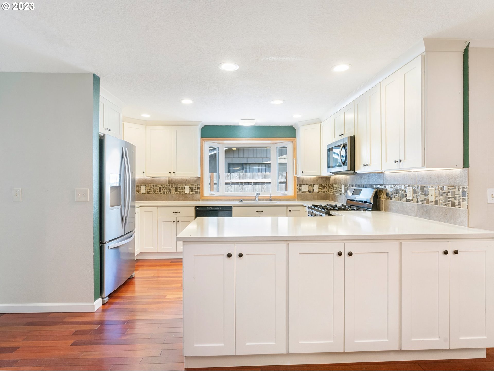 17875 Southwest Shawnee Trail Tualatin, OR 97062 - Photo 6 of 44 a kitchen with white cabinets and sink