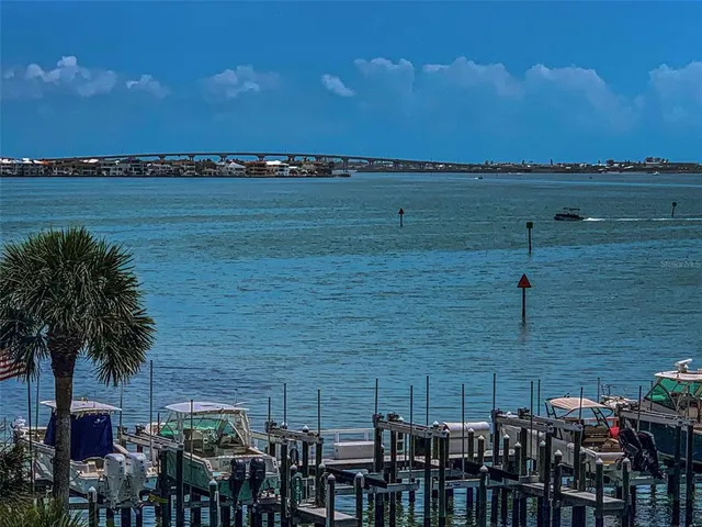 a large kitchen with stainless steel appliances lots of counter space and a sink