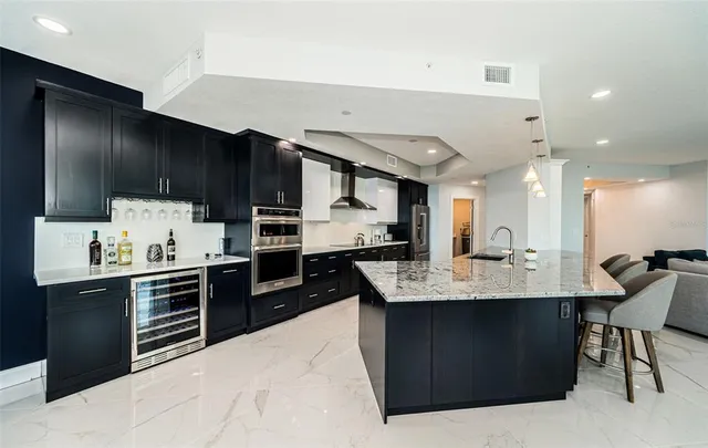 a bathroom with a granite countertop sink and a toilet