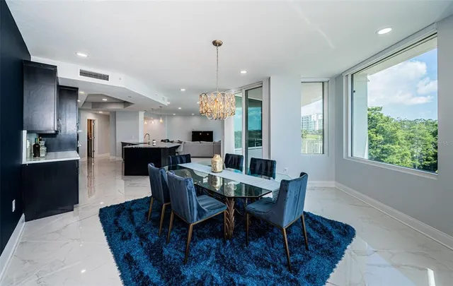 a spacious bathroom with a granite countertop sink and a mirror