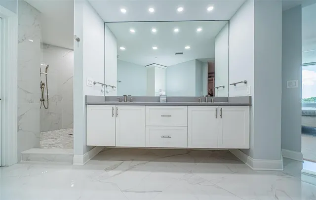 a view of a swimming pool with outdoor seating and plants