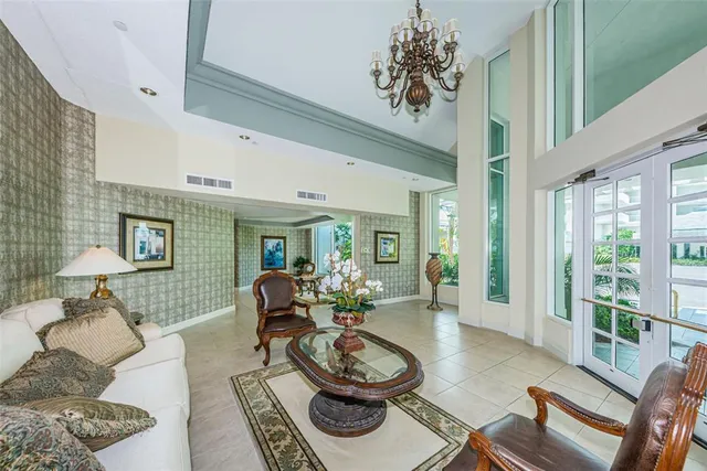 a view of a hallway with wooden floor and a living room