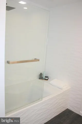 a bathroom with a sink a mirror and a toilet