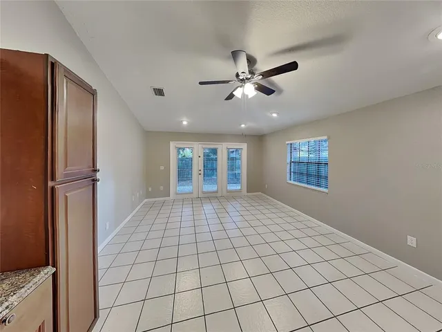 a view of a livingroom with a projector and furniture