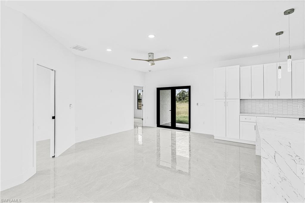 343 Pullman Street Lehigh Acres, FL 33974 - Photo 15 of 48 a view of an empty room with a window