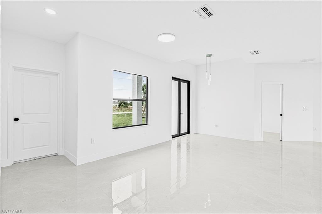 343 Pullman Street Lehigh Acres, FL 33974 - Photo 17 of 48 a view of an empty room with a window