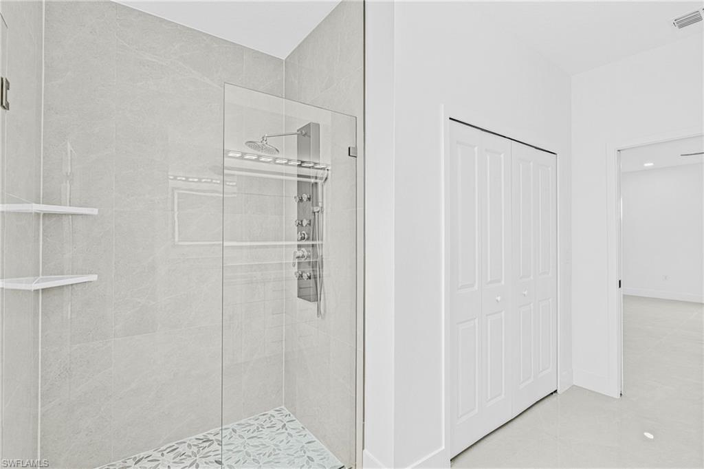 343 Pullman Street Lehigh Acres, FL 33974 - Photo 24 of 48 a bathroom with a shower