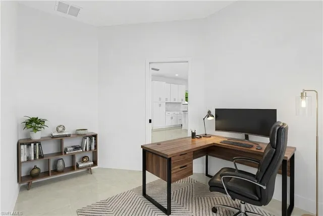a view of a workspace with furniture