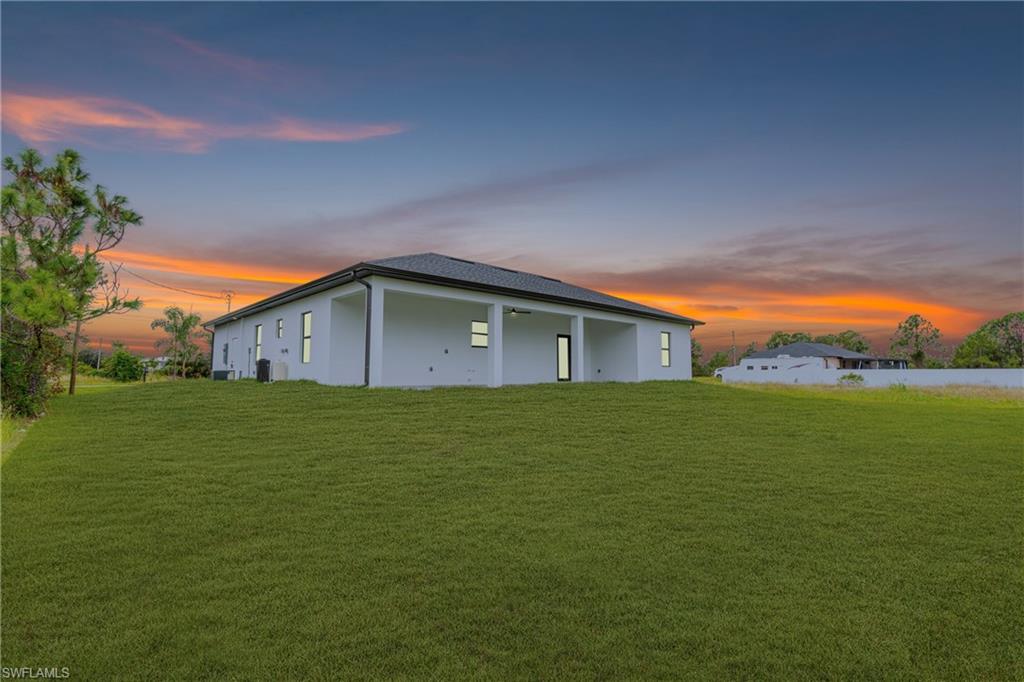 343 Pullman Street Lehigh Acres, FL 33974 - Photo 37 of 48 a backyard of a house