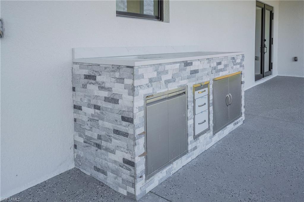 343 Pullman Street Lehigh Acres, FL 33974 - Photo 38 of 48 a view of a storage & utility room