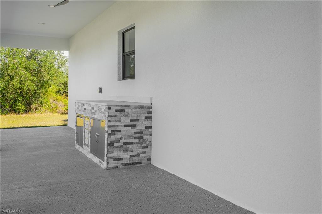 343 Pullman Street Lehigh Acres, FL 33974 - Photo 39 of 48 a view of a hallway with closet
