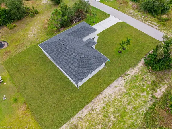 a view of a back yard of the house