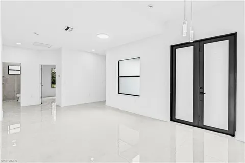 a view of an empty room with a window