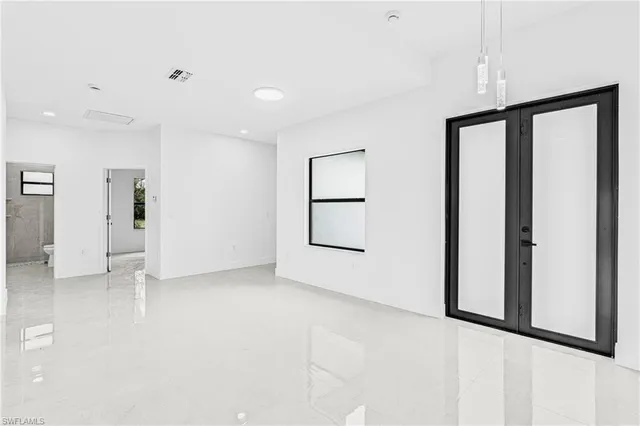 a view of an empty room with a window