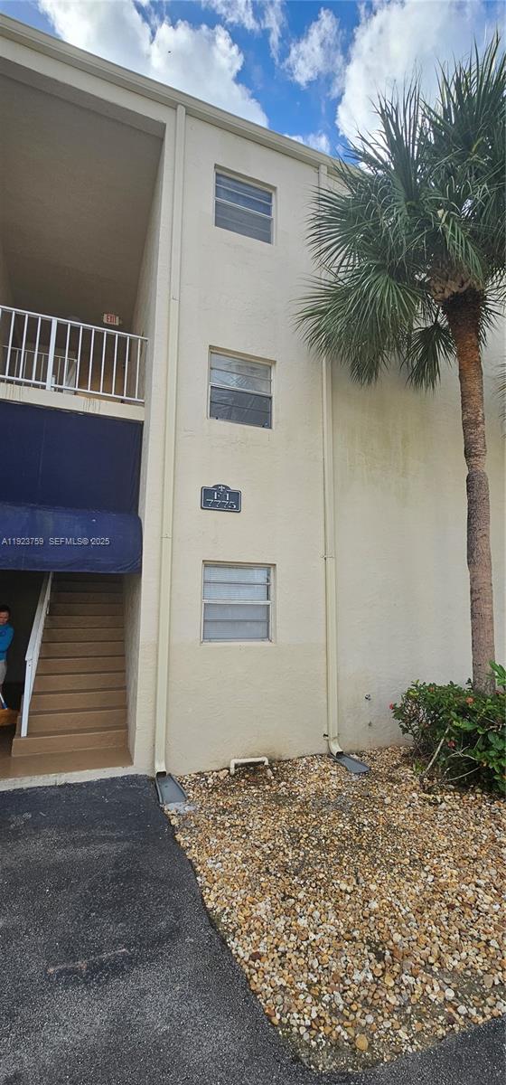 7775 Southwest 86th Street, Unit F1301 Miami, FL 33143 - Photo 1 of 20 a front view of a house