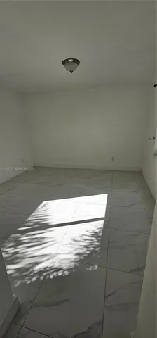 an empty room with wooden floor