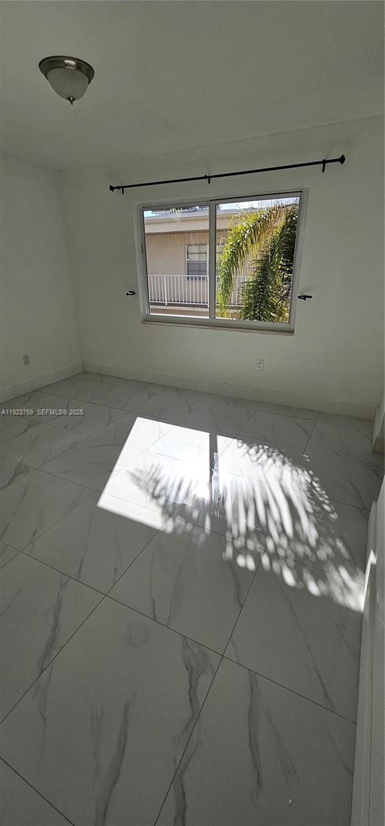 7775 Southwest 86th Street, Unit F1301 Miami, FL 33143 - Photo 19 of 20 a view of empty room with window