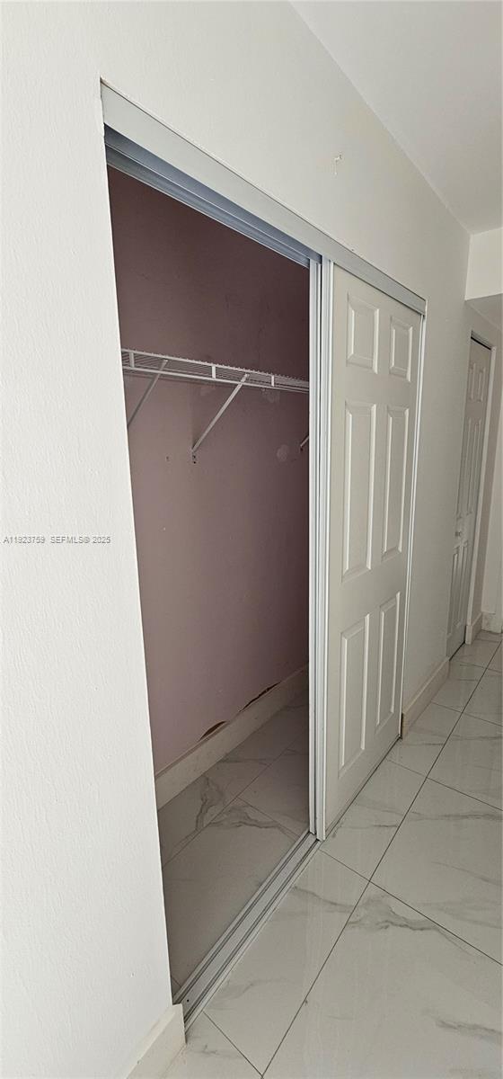 7775 Southwest 86th Street, Unit F1301 Miami, FL 33143 - Photo 20 of 20 an empty room with wooden floor