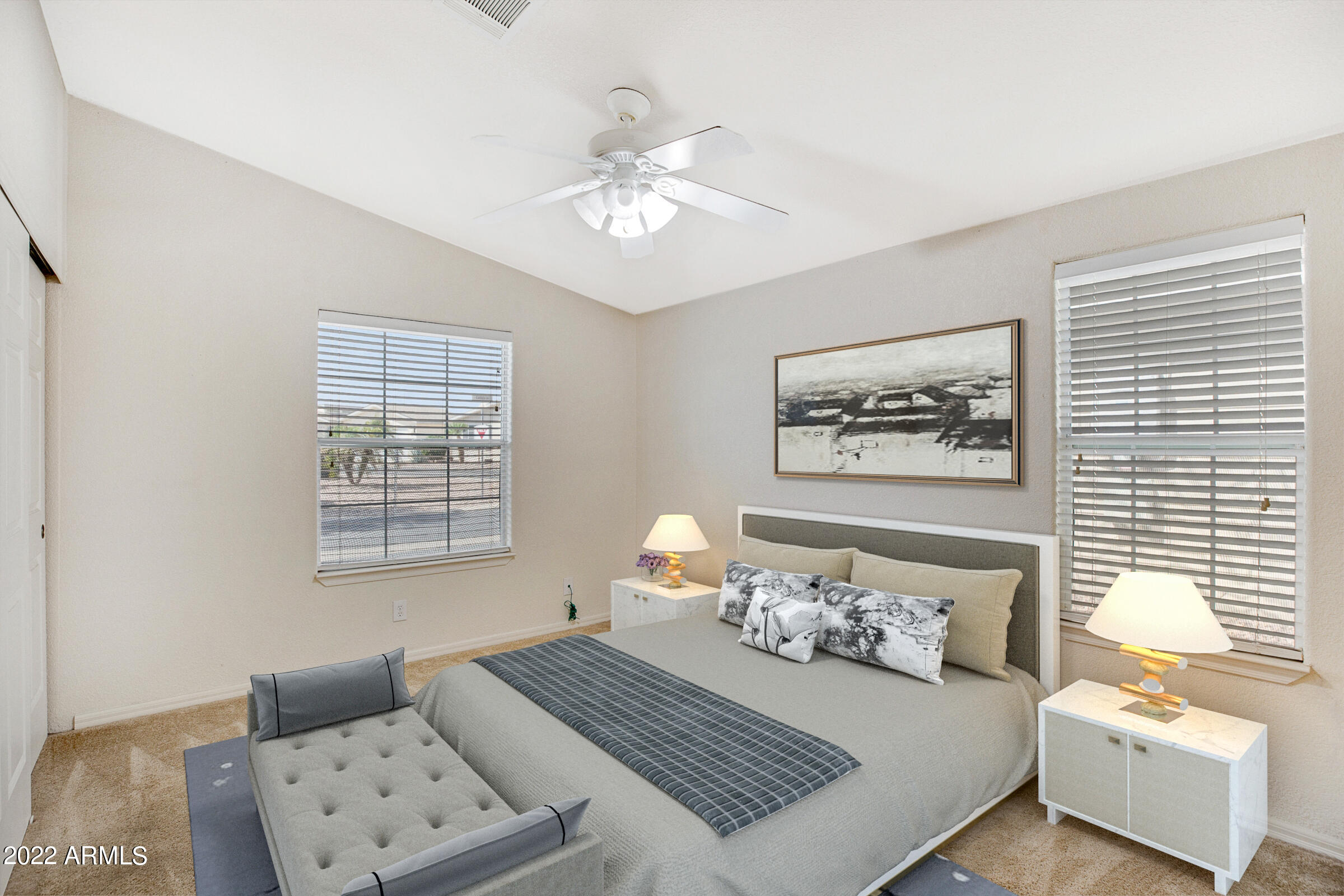 3301 South Goldfield Road, Unit 4083 Apache Junction, AZ 85119 - Photo 11 of 12 a bedroom with a bed and a couch