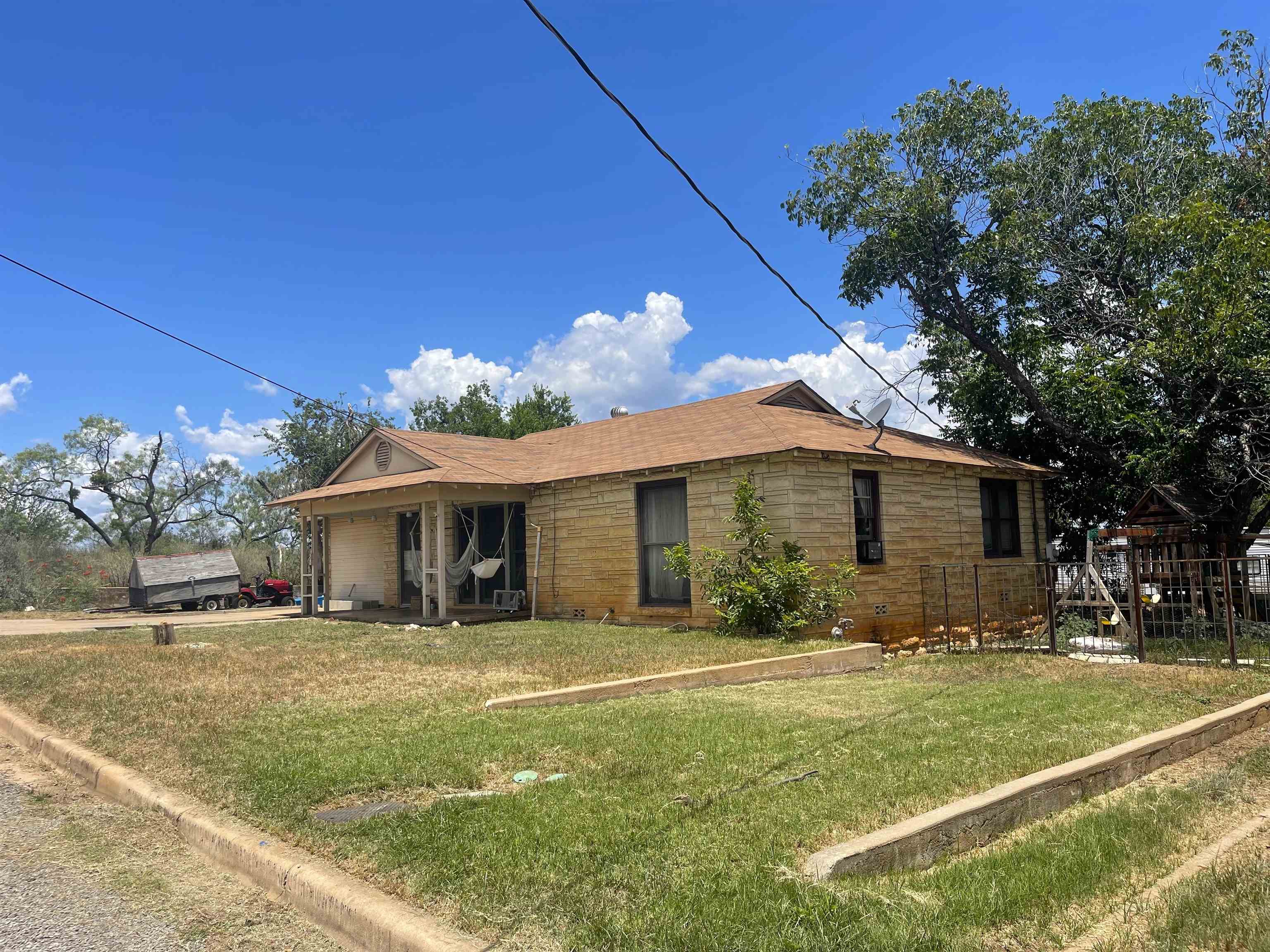 409 West Wallace Street Llano, TX 78643 - Photo 2 of 10 a view of a house with a yard